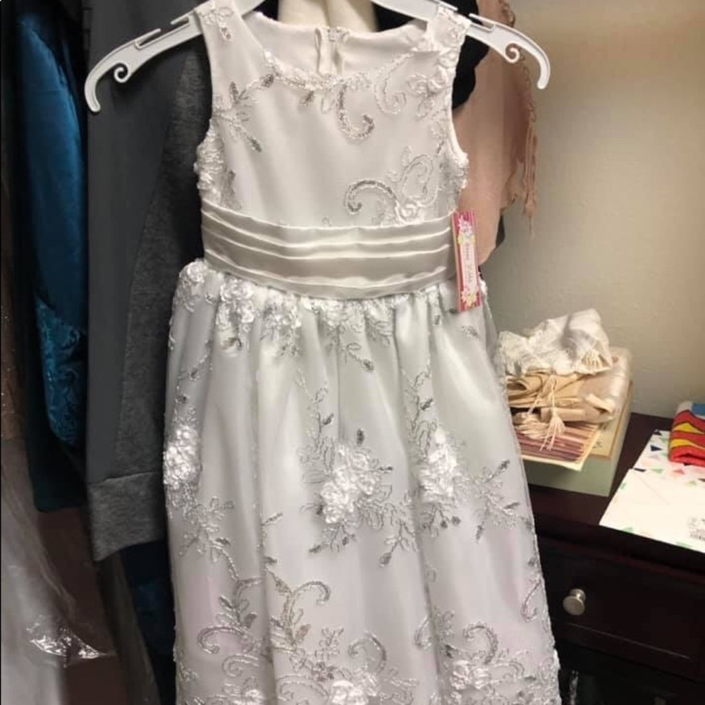 New with tags communion/flower girls dress.